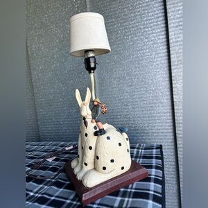 Williray Studio WW1506 lamp of woman- a heart in hand and riding a giant hare.